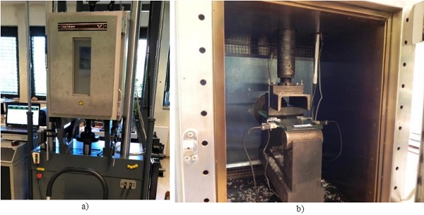 Fig. 5 Environmental chamber a) and three-point bending test setup prepared in the environmental chamber b) to ensure elevated temperature during the test.