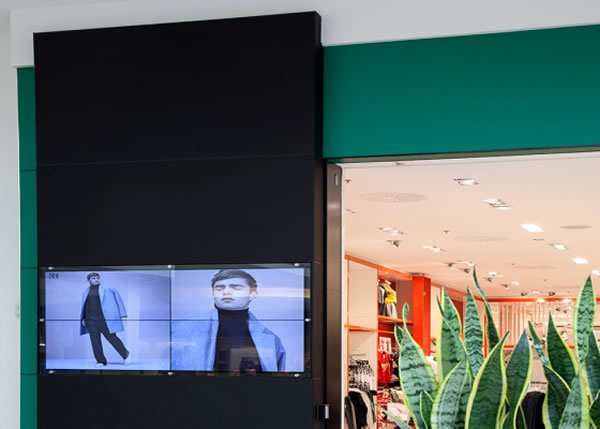 Simons storefront with Satinlite acid-etched glass back painted black and green