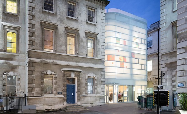 The building features a softened, translucent exterior in the day, which lights up like a lantern at night. Photography: Iwan Baan for Steven Holl Architects