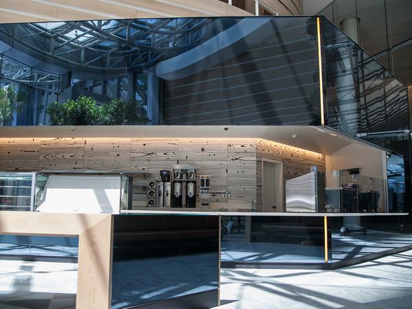 Giroux’s work can be seen in the café, where all of the walls are a dark back-painted glass. Giroux’s work can be seen in the café, where all of the walls are a dark back-painted glass.