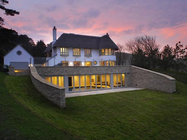 Rooflights installed in thatched coastal cottage for ventilation and access