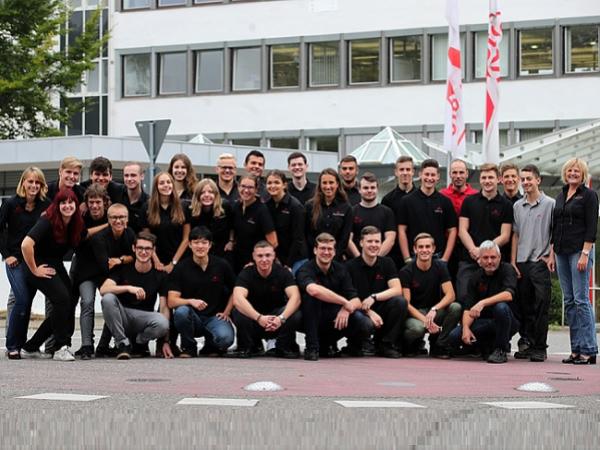 The image shows the General Head of Training Erika Dittmann-Frank (far right) and the Head of Technical Training Markus Schwarz (bottom row on the right).