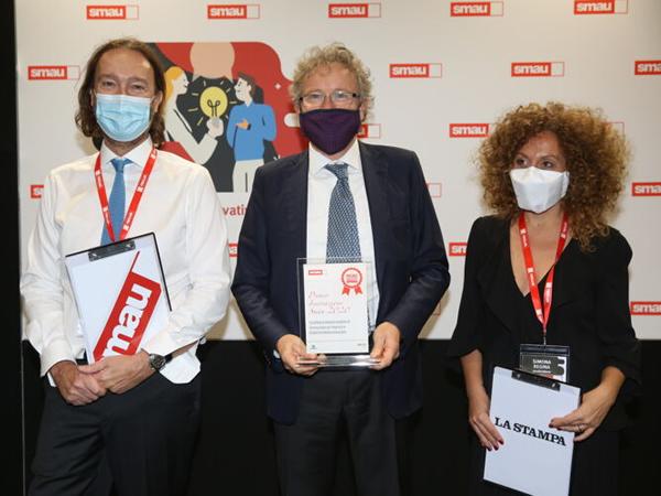 Marco Mancini, Scm Group's General Manager, with Pierantonio Macola, Smau’s President, and Simona Regina, journalist at Radio Rai.