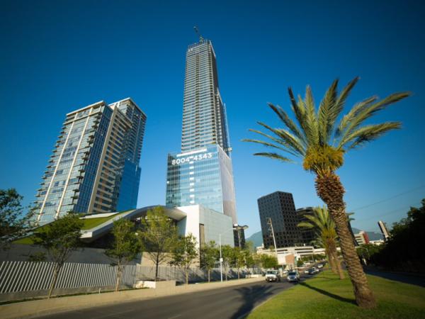 The 68-story KOI Tower in Monterrey, Mexico, features a facade composed primarily of double-pane insulating glass units (IGUs) fabricated with Solarban® R100 Optiblue® glass by Vitro Architectural Glass.