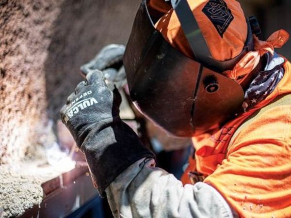 A Nortex Glass & Mirror employee wears a safety shield while working. A Nortex Glass & Mirror employee wears a safety shield while working.